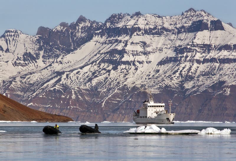 Tourist icebreaker at Antarcticahaven in the High Arctic on the coast of north eastern Greenland. Tourist icebreaker at Antarcticahaven in the High Arctic on the coast of north eastern Greenland.