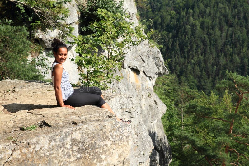 Tourist sitting at the edge of Thomas?s View in Slovak Paradise