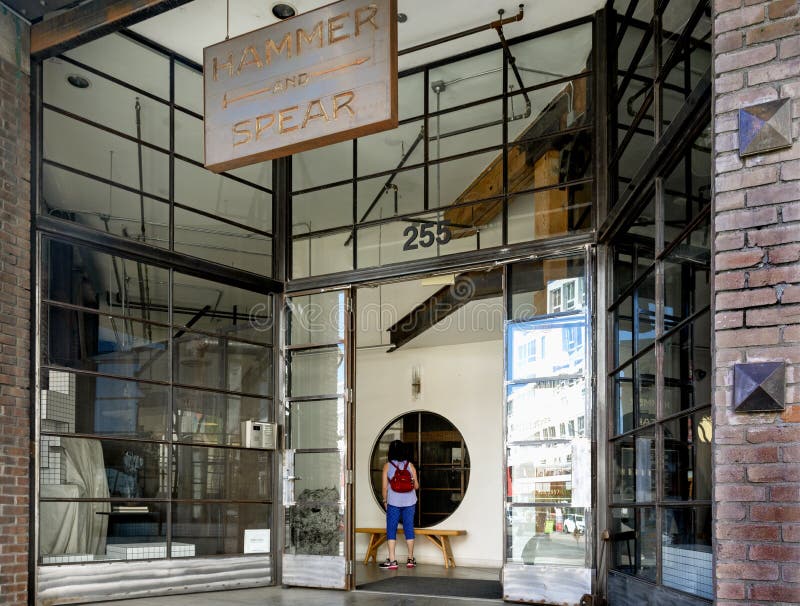 Tourist Stands at Entrance of Gentrified Historical Building in Arts District of Downtown Los Angeles