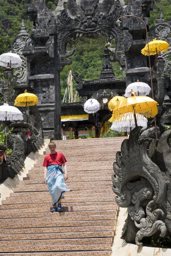 Tourist on the steps of the temple. Indonesia. Bali royalty free stock images Tourist on the steps of the temple. Indonesia. Bali royalty free stock images