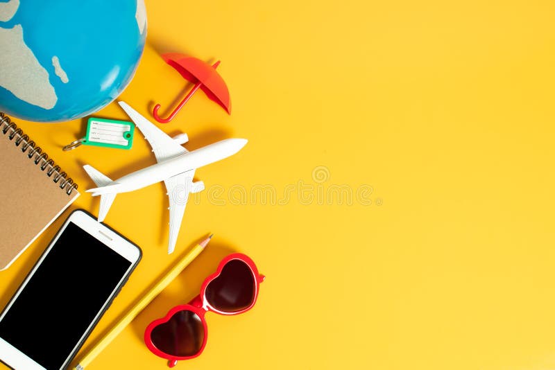 tourist travel and education concept, earth globe map with airplane toy, note paper book, smartphone and network, pencil, summer f