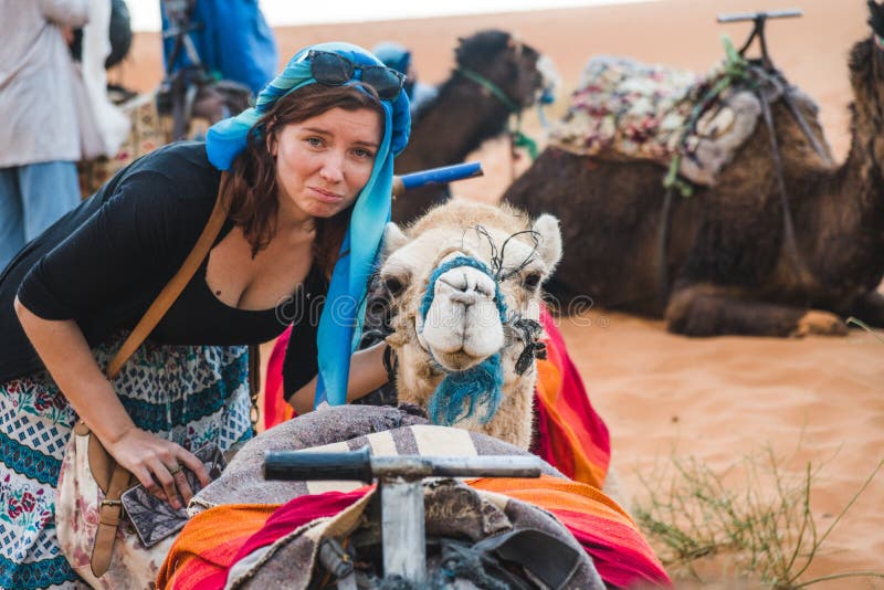 Tourist Traveler Girl Looking Sad for the Camels Used in Morocco for Desert  Tours. Anti Animal Abuse in Tourism Concept Stock Image - Image of ancient,  animals: 161101451