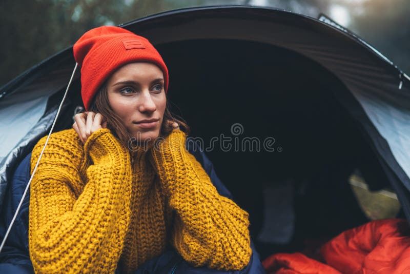 Tourist traveler ralaxing in camp tent in froggy mist forest, portrait lonely hiker woman enjoy nature trip, green trekking royalty free stock photo Tourist traveler ralaxing in camp tent in froggy mist forest, portrait lonely hiker woman enjoy nature trip, green trekking royalty free stock photo