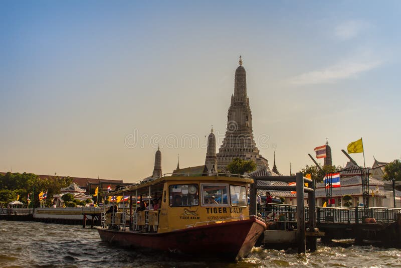 Tourist visited Wat Arun, the temple of dawn by Chao Phraya Express Boat and ferry for sightseeing tour in Bangkok along the Chao