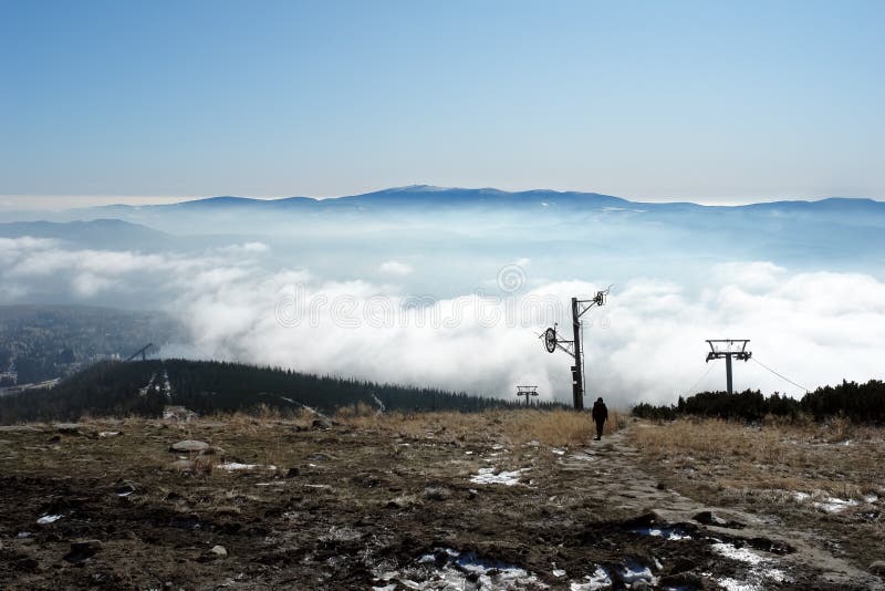 Tourist walking along a path in the mountains of the High Tatras.