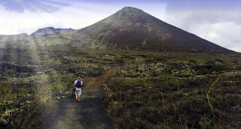 Tourist walking to Volcano La Corona - Lanzarote, Canary Islands, Spain