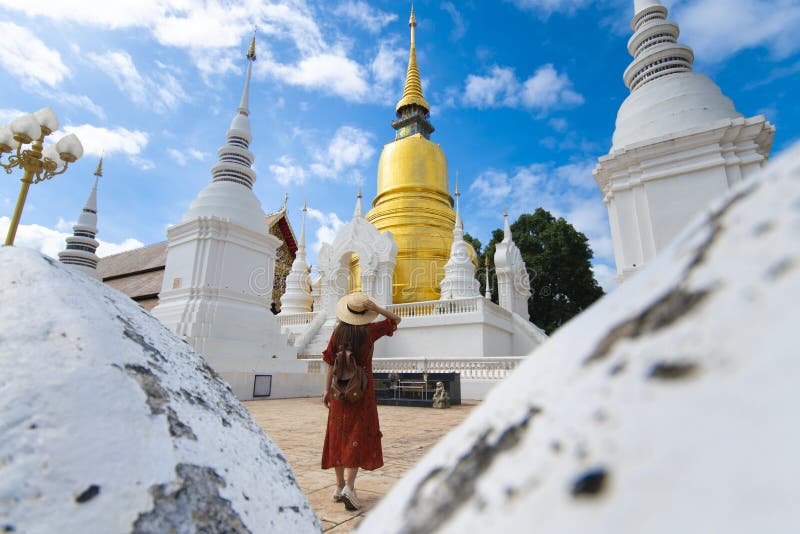 Tourist woman is sightseeing in Wat Suan Dok in Chiangmai stock photo Tourist woman is sightseeing in Wat Suan Dok in Chiangmai stock photo