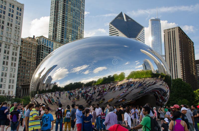 Tourists at Chicago Millennium Park in front of bean structure. Tourists at Chicago Millennium Park in front of bean structure