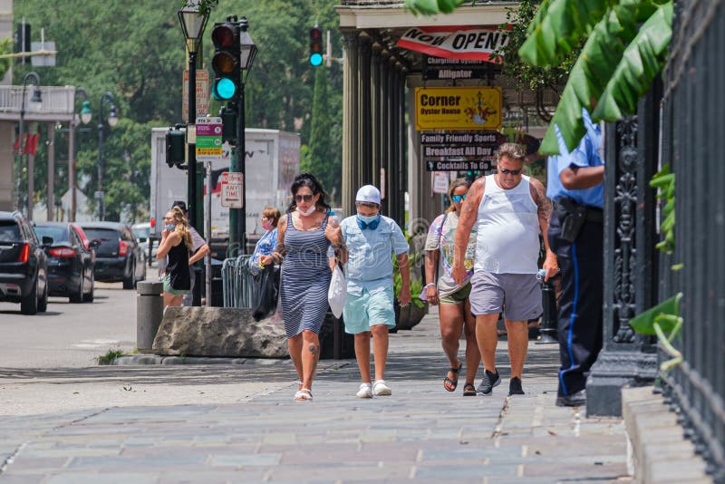 New Orleans, Louisiana/USA - 7/8/2020: Tourists outside Jackson Square in the French Quarter during corona virus pandemic. New Orleans, Louisiana/USA - 7/8/2020: Tourists outside Jackson Square in the French Quarter during corona virus pandemic