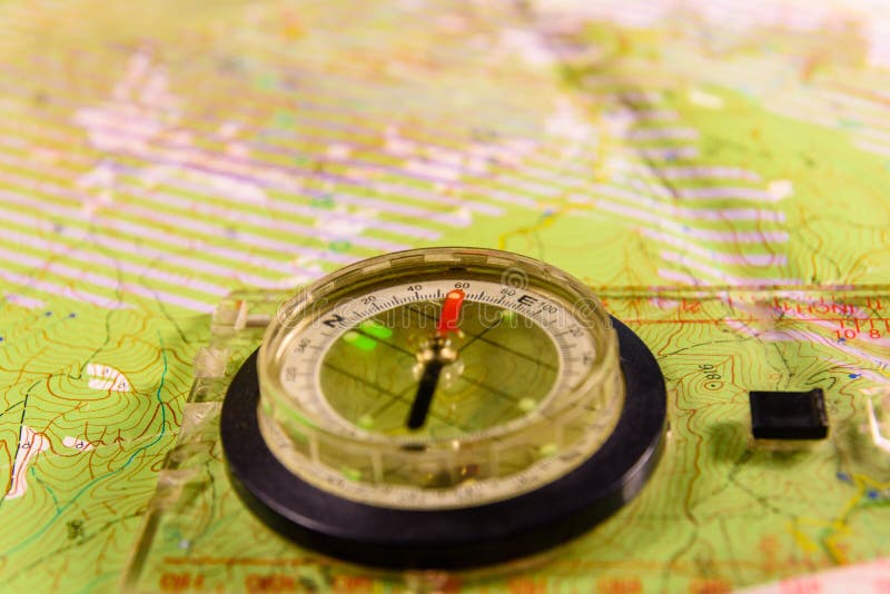 Magnetic Compass Lying on Topographical Map Stock Image - Image of ...