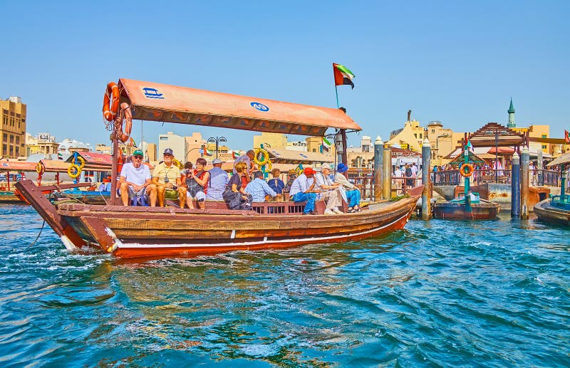 Tourists on abra boat, Dubai, UAE stock photos