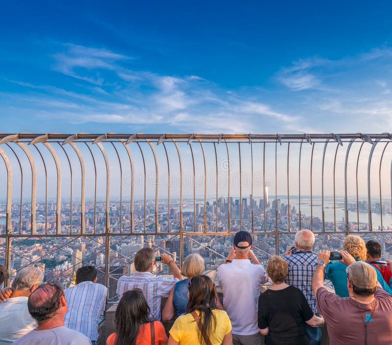 Tourists amazed by New York sunset skyline stock image