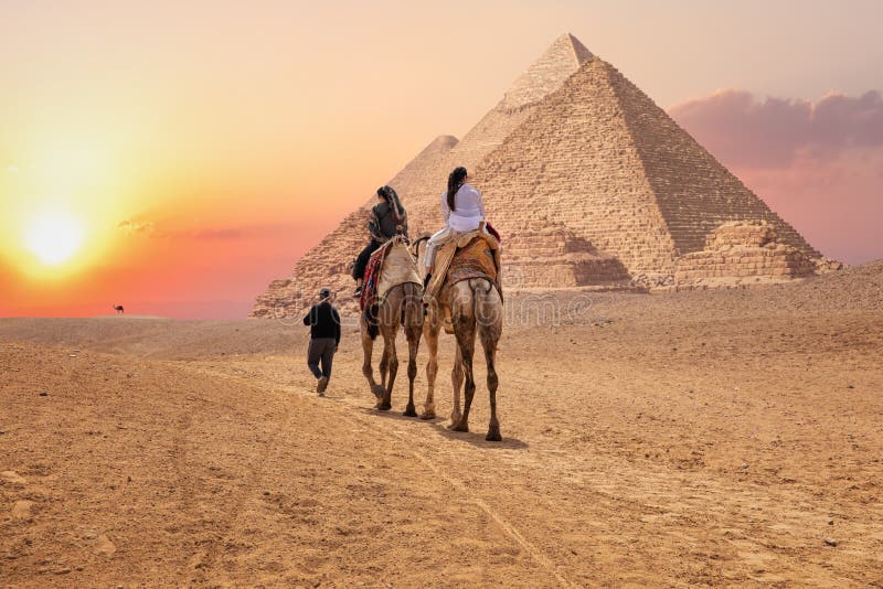 Tourists on camels near the Great Pyramids of Giza, Egypt royalty free stock images Tourists on camels near the Great Pyramids of Giza, Egypt royalty free stock images