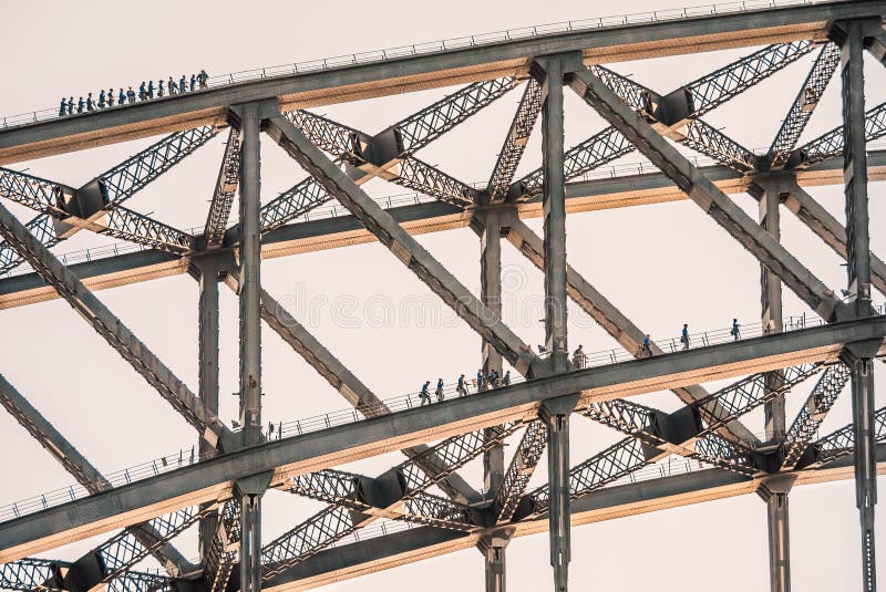 Tourists climb on two layers of the Sydney Harbour Bridge