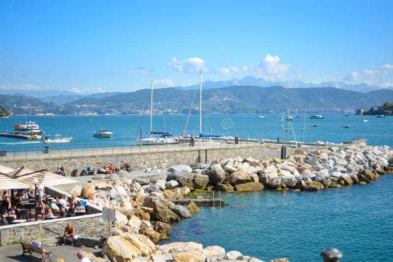 Tourists enjoy a sunny day seaside at marinas and cafes in the Gulf of Poets on the Ligurian coast of Porto Venere, Italy. royalty free stock photo Tourists enjoy a sunny day seaside at marinas and cafes in the Gulf of Poets on the Ligurian coast of Porto Venere, Italy. royalty free stock photo