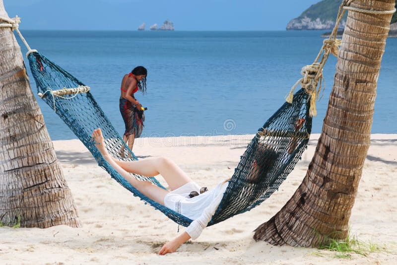 Tourists girls relaxing on the beach royalty free stock photo Tourists girls relaxing on the beach royalty free stock photo