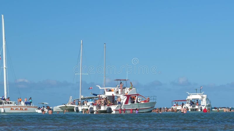 Tourists having fun on excursion on party boat in Caribbean Sea