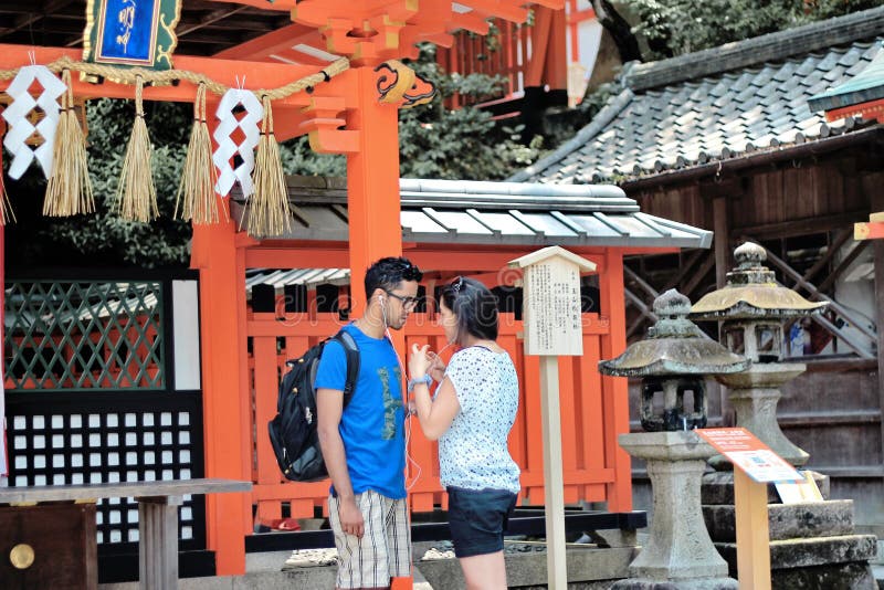 Tourists listen to music, share the love,within shrine . royalty free stock photo Tourists listen to music, share the love,within shrine . royalty free stock photo
