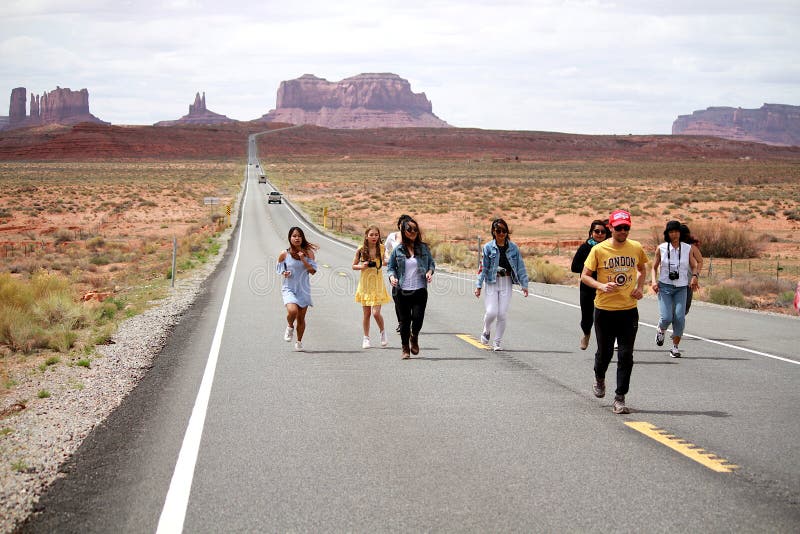 Tourists reenacting a scene from the movie Forrest Gump near Monument Valley, Utah