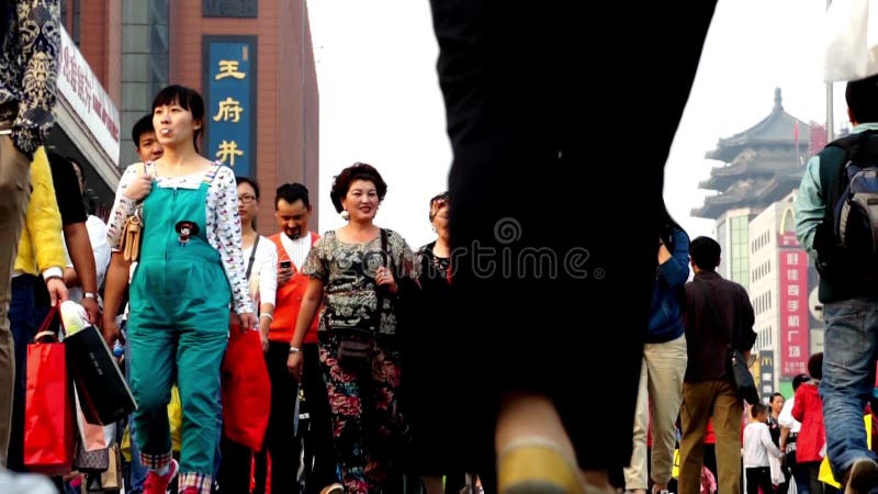 Tourists roam Wangfujing Walking Street in Beijing