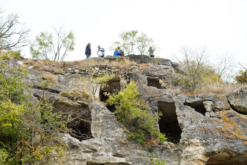 Tourists on ruins medieval city Chufut-Kale Crimea stock images