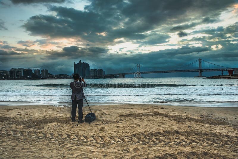 Tourists are shooting Gwangan Bridge and Haeundae at Busan, South Korea. royalty free stock photo Tourists are shooting Gwangan Bridge and Haeundae at Busan, South Korea. royalty free stock photo