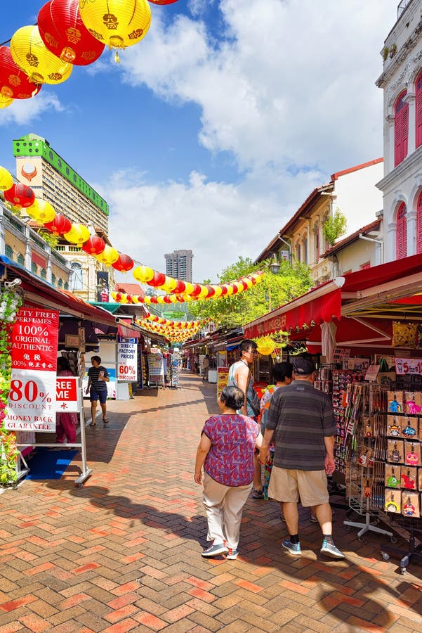 Tourists in Singapore Chinatown Street Market Decorated with Pap