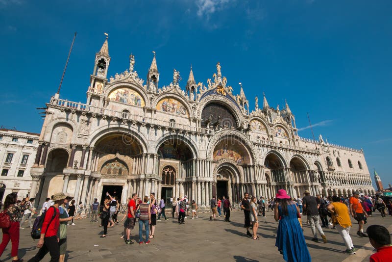 Tourists on the square in front the St. Mark`s Basilica of Venice