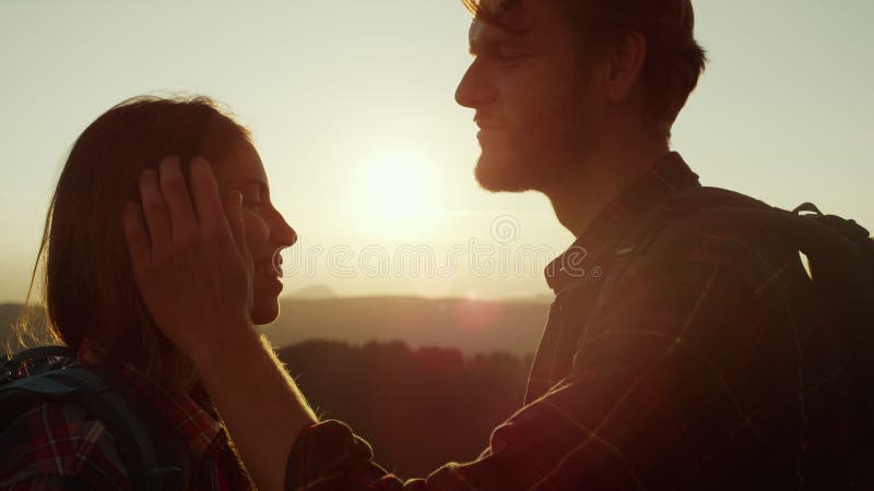 Tourists Standing on Top of Mountain at Sunset. Loving Man Touching Woman  Hair Stock Image - Image of touching, weekend: 214120863