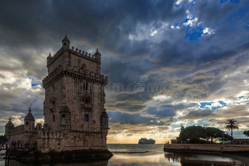 Tourists visit the famous Belem Tower near Lisbon with beautiful sunset over Atlantic Ocean. Tourists visit the famous Belem Tower near Lisbon with beautiful sunset over Atlantic Ocean