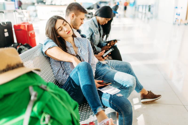 Tourists waiting for delayed departure in airport stock image Tourists waiting for delayed departure in airport stock image