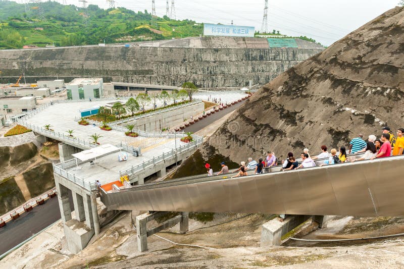 Tourists walk down the escalator with a viewing platform