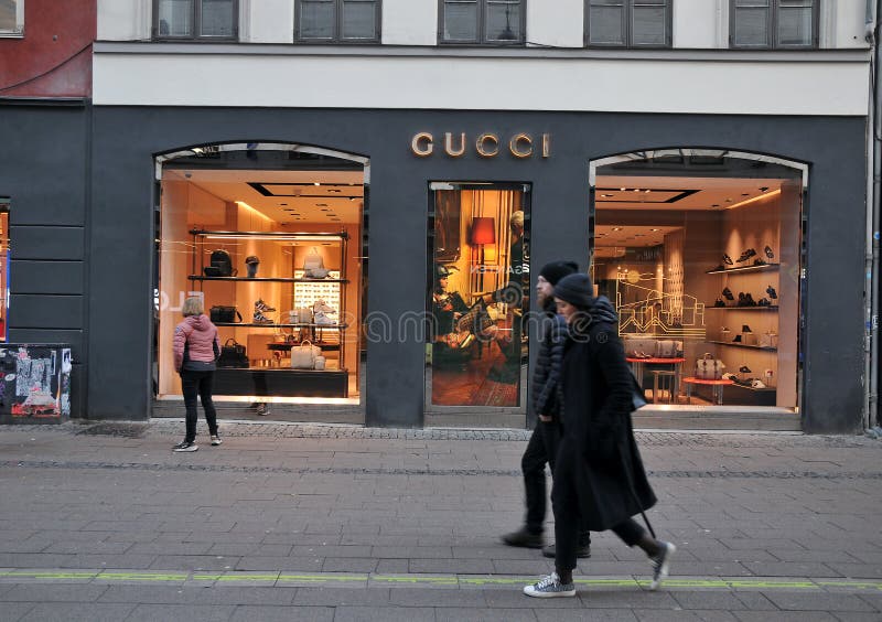 Tourists Walk by Gucci Store on Stroeget in Danish Capital Photo - Image stoe: 233384546