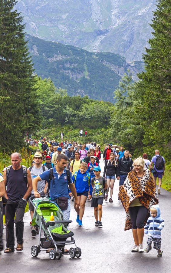 Tourists walking on road to Morskie Oko lake in High Tatras, Poland