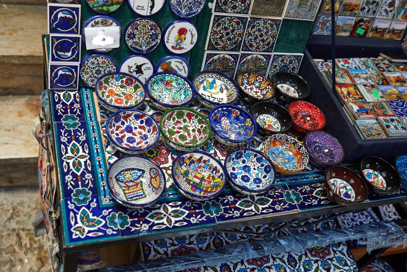 All the colors, tastes and flavors of the Middle East tourists can find in Arab Bazaar on King David&#x27;s street. Jerusalem, Israel - July 10, 2019: , old, city, historic, architecture, landmark, tourism, jewish, history, israeli, travel, ancient, stone, quarter, historical, house, building, cityscape, residential, cobblestone, urban, wall, famous, view, nobody, narrow, neighborhood, way, path, houses, antique, district, sky, town, outdoors, blue, landscape, mishkenot, summer, vertical, stoned, yemin, moshe, davids. All the colors, tastes and flavors of the Middle East tourists can find in Arab Bazaar on King David&#x27;s street. Jerusalem, Israel - July 10, 2019: , old, city, historic, architecture, landmark, tourism, jewish, history, israeli, travel, ancient, stone, quarter, historical, house, building, cityscape, residential, cobblestone, urban, wall, famous, view, nobody, narrow, neighborhood, way, path, houses, antique, district, sky, town, outdoors, blue, landscape, mishkenot, summer, vertical, stoned, yemin, moshe, davids