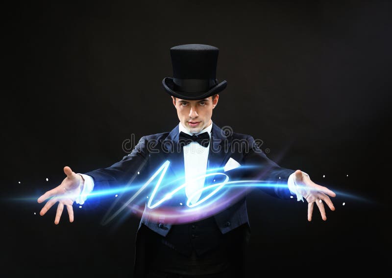 Magic, performance, circus, show concept - magician in top hat showing trick. Magic, performance, circus, show concept - magician in top hat showing trick