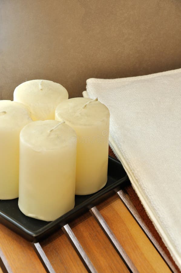 Towel and wax candle for SPA