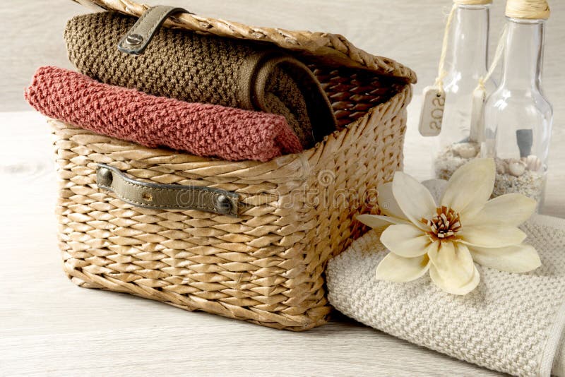 Towels in a wicker basket stock image. Image of flowers 67369085