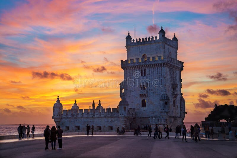 Tower of Belem ( Torre de Belem ) with beautiful burning fire sky at sunset, Lisbon, Portugal. Listed on UNESCO World Heritage Site. Tower of Belem ( Torre de Belem ) with beautiful burning fire sky at sunset, Lisbon, Portugal. Listed on UNESCO World Heritage Site.