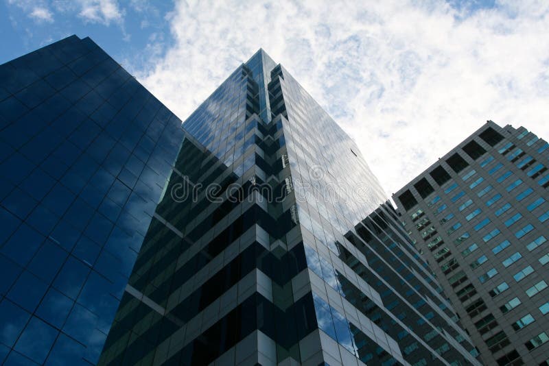 Glass square Tower building in blue sky with reflection of blue sky. Perspective ant stock images, royalty-free photos and pictures