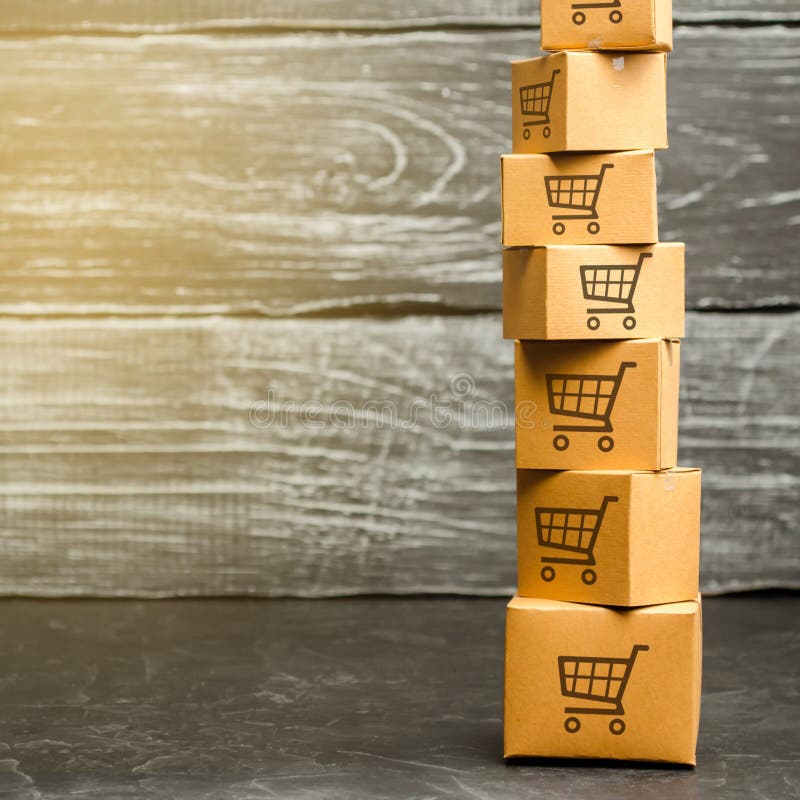 Tower of cardboard boxes with pattern of shopping carts. Purchasing power, delivery order. E-commerce, logistics, distribution. commerce, online shopping. Sales of goods and services. Copy space. Background package pattern stock images, royalty-free photos and pictures