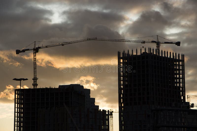 Tower Crane Against the Blue Sky, the Process of Building a Multi