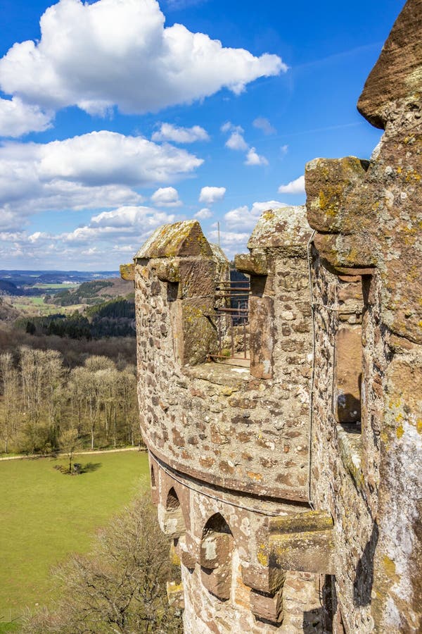 Tower house of Kasselburg Castle in Pelm, Rhineland-Palatinate, Germany partial view. White fluffy cumulus clouds royalty free stock photo Tower house of Kasselburg Castle in Pelm, Rhineland-Palatinate, Germany partial view. White fluffy cumulus clouds royalty free stock photo