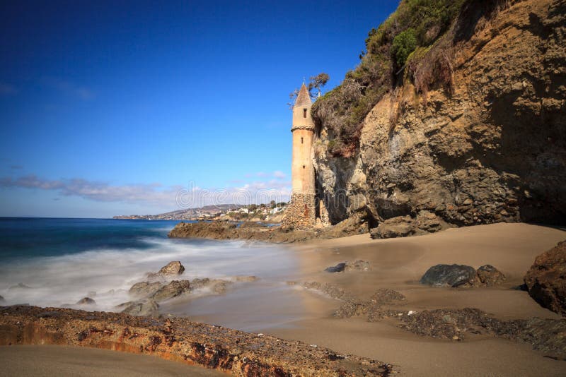 Tower Over Rocky Shores at Victoria Beach in Laguna Beach Stock Photo ...