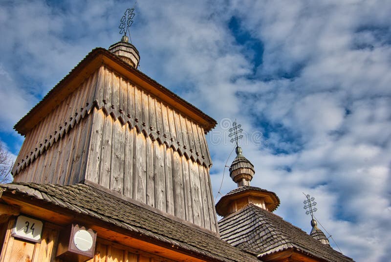 Wooden towers with Slovak crosses of church in Korejovce during autumn