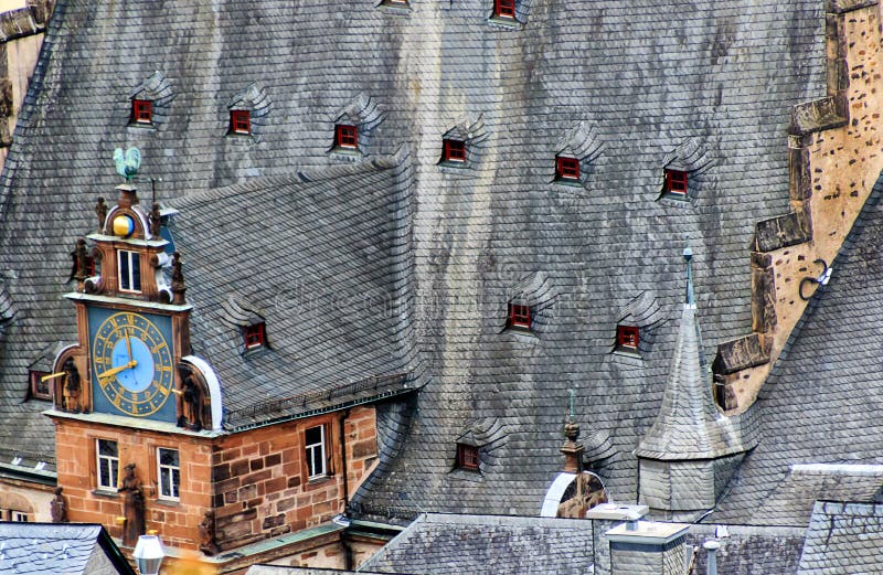 Town Hall roof top renaissance tower with the clock gable in university town of Marburg, Hesse, Germany. Town Hall roof top renaissance tower with the clock gable in university town of Marburg, Hesse, Germany