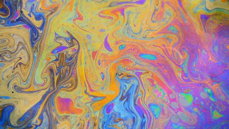 Toxic colours of oil and water in a chemical spill creating a psychedelic blur of rainbow colours. Copyspace area for environmental and pollution based themes and designs. Toxic colours of oil and water in a chemical spill creating a psychedelic blur of rainbow colours. Copyspace area for environmental and pollution based themes and designs