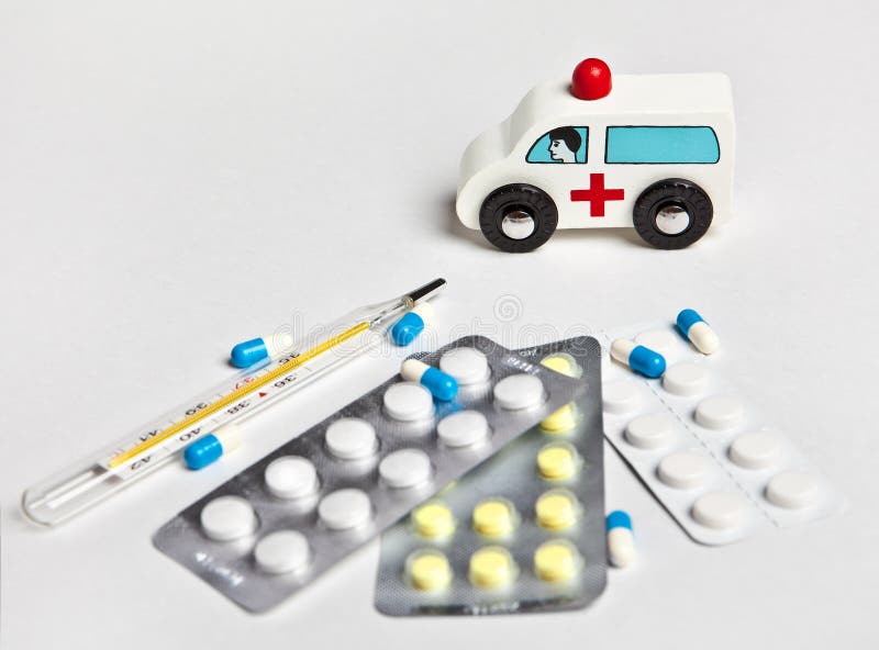 Toy ambulance next to the medication and mercury thermometer