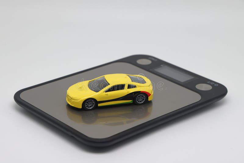Toy Car on Kitchen Electronic Scales, the Cost of Buying and Operating