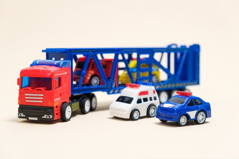 Toy Car Transporter with Cars on a White Background with Place for Text ...